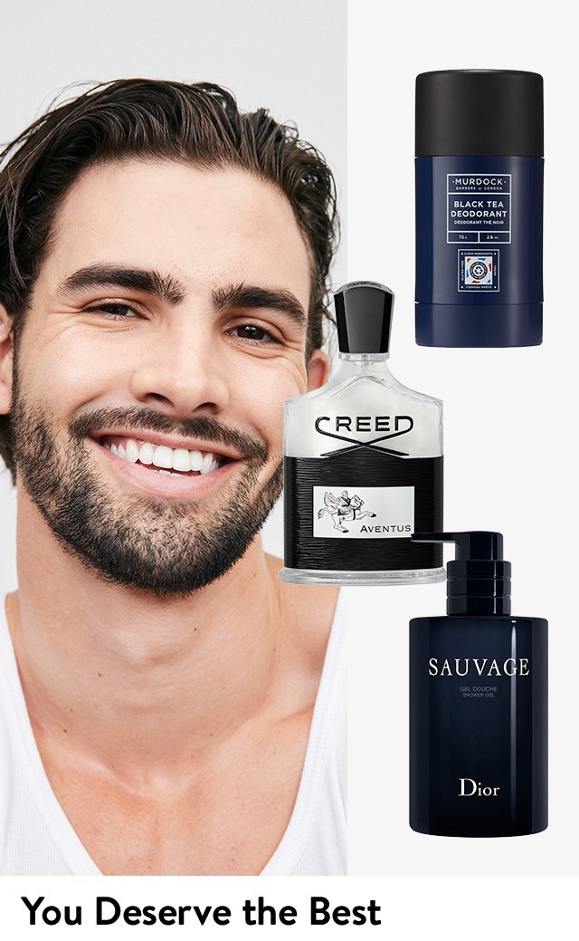 A smiling, well-groomed man. Men's grooming products from Murdock London, Creed and DIOR.