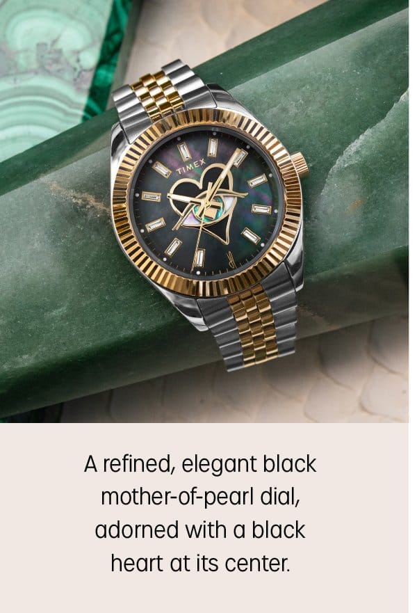 A refined, elegant black mother-of-pearl dial, heart at its center.