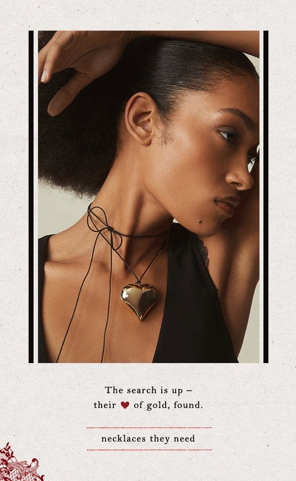 Woman wearing heart pendant. Shop necklaces.
