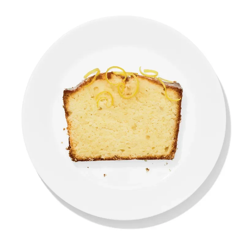 A slice of lemon pound cake on a plate.