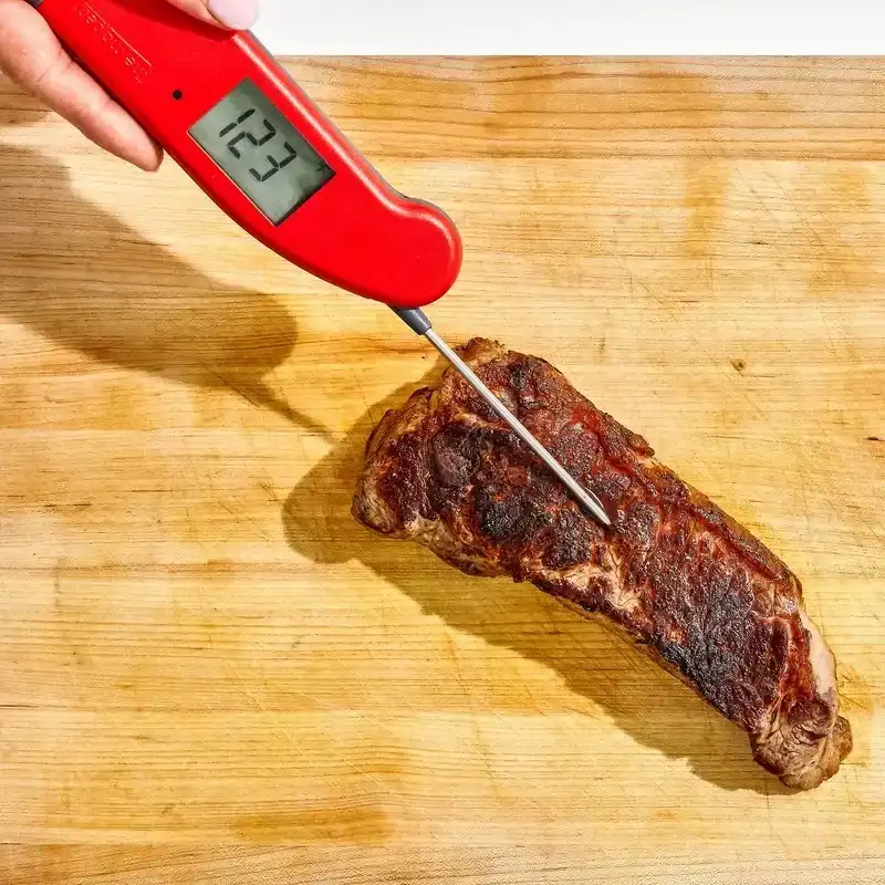 One of the best meat thermometers inserted into steak. 