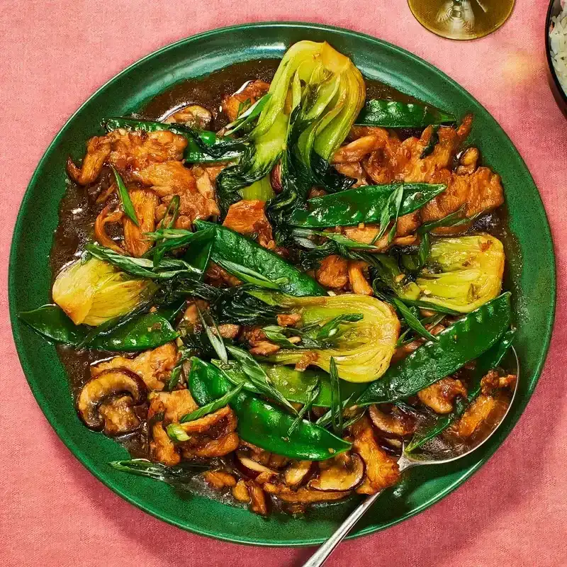 Ginger-Garlic Chicken and Vegetable Stir-Fry on a green plate