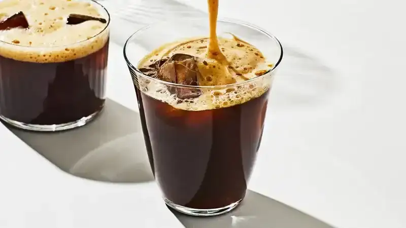 carajillo in a glass on a white surface 