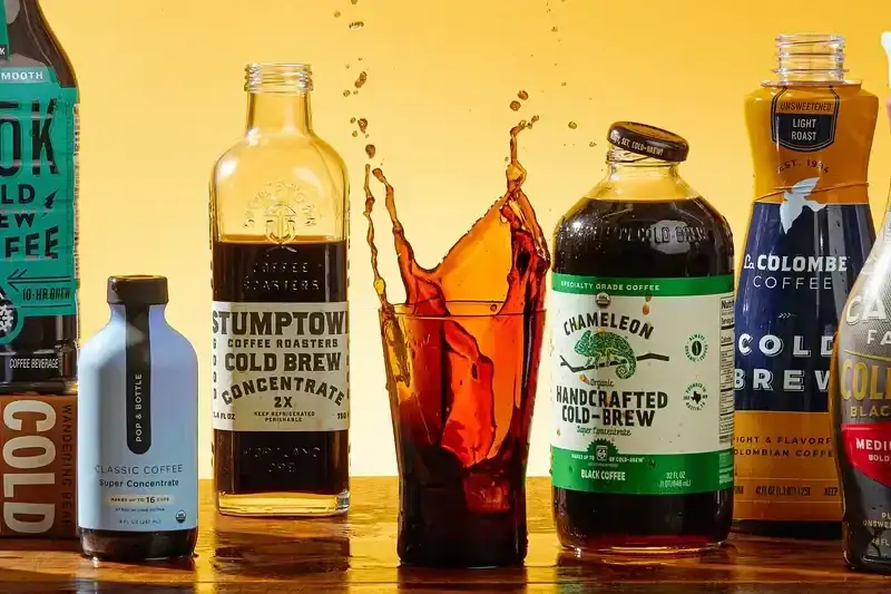 A variety of different cold brews on a wooden surface
