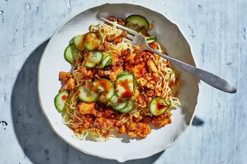 Saucy Tofu Noodles With Cucumbers and Chili Crisp recipe