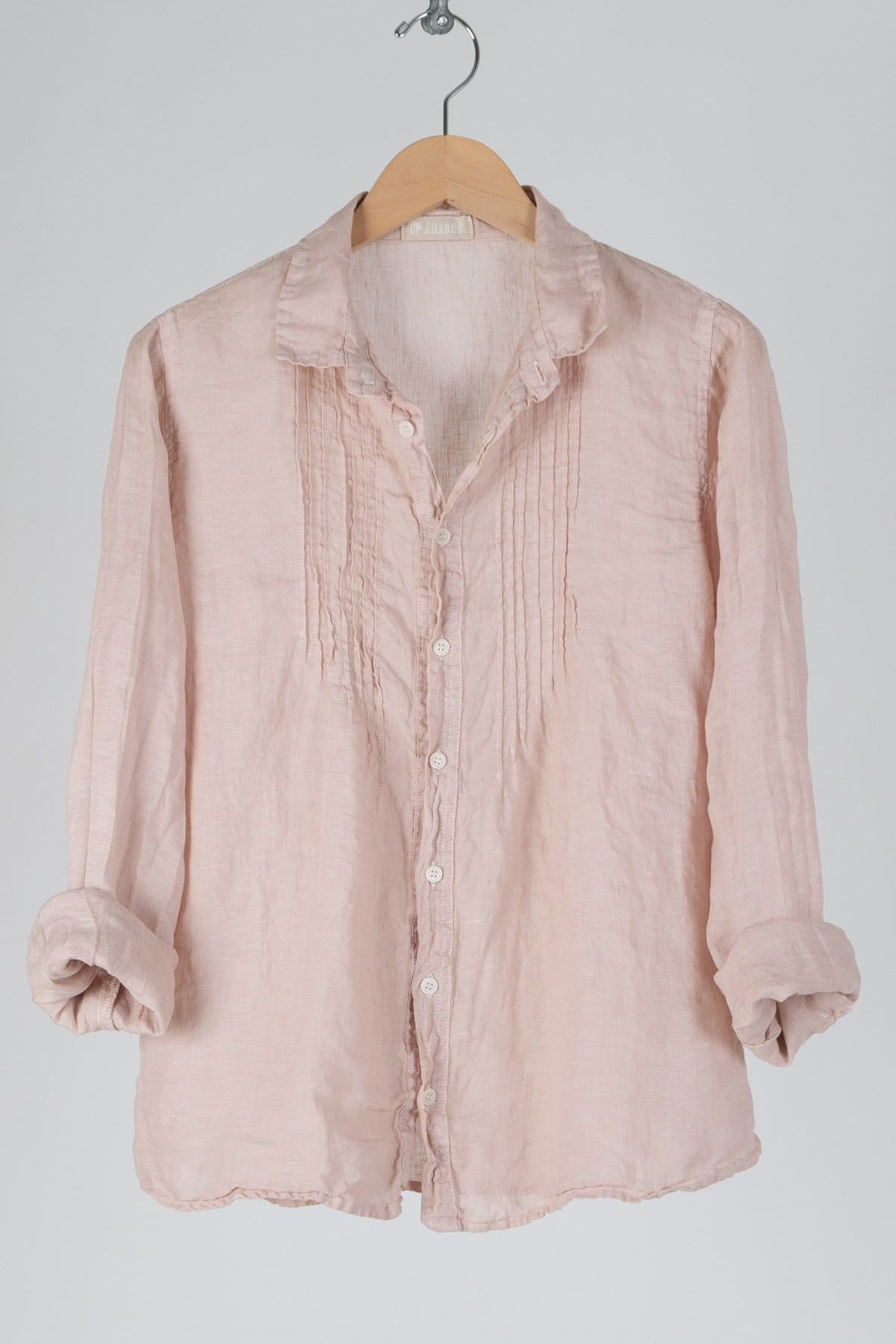 Button down linen shirt with larger pleads in a sand color