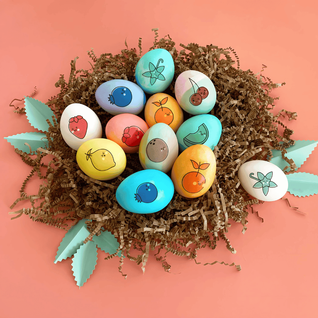 Colored easter eggs in paper nest with temporary tattoos