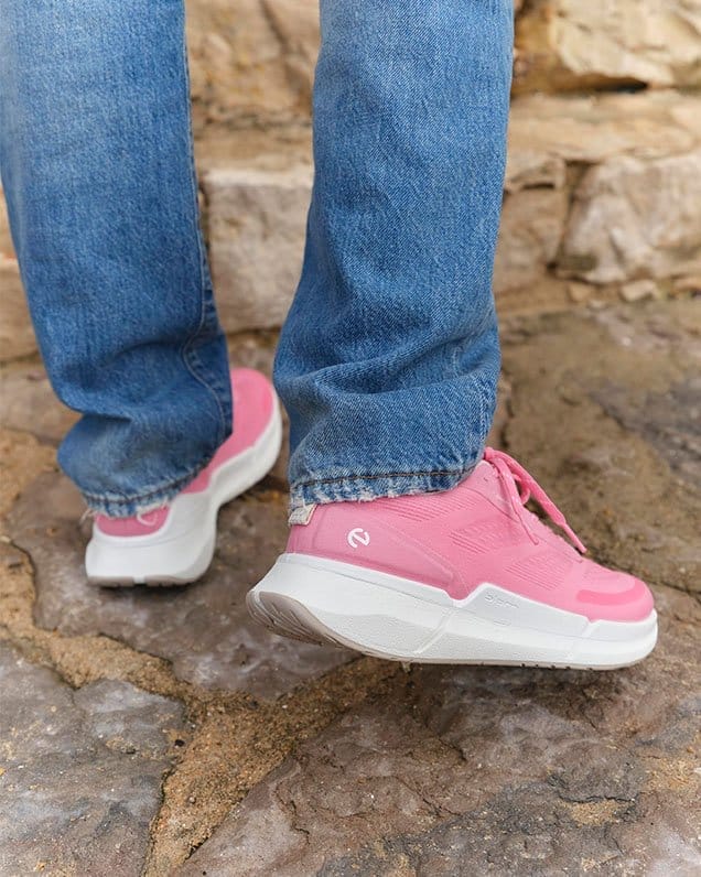Model wearing pink sneakers