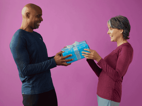 Man and woman exchanging a gift