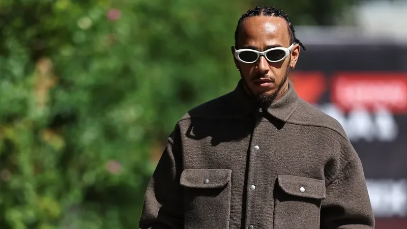 Image may contain: Lewis Hamilton, Accessories, Sunglasses, Clothing, Coat, Jacket, Glasses, Adult, Person, Face, and Head