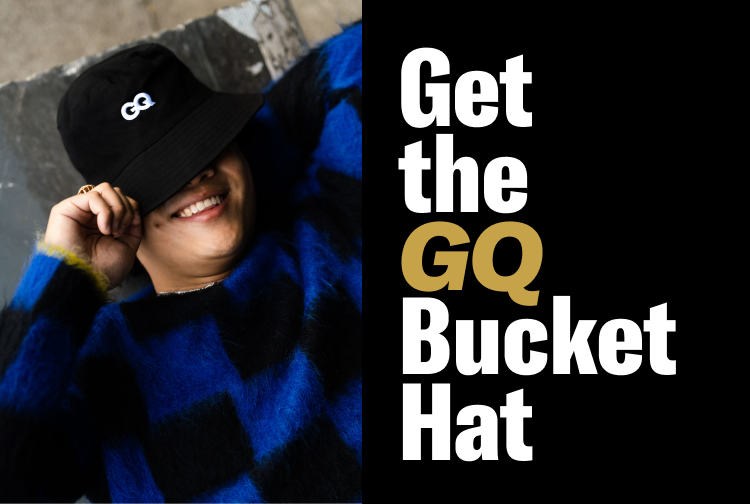 Always in style. A person wearing the GQ bucket hat.