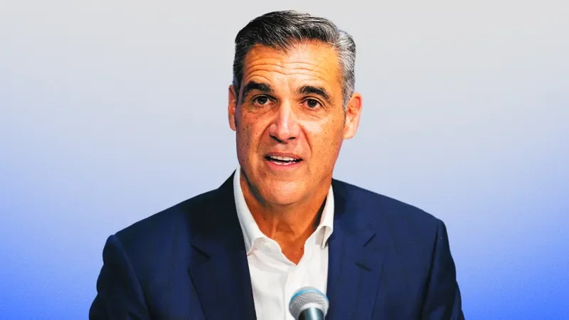 Image may contain: Jay Wright, Blazer, Clothing, Coat, Jacket, Face, Head, Person, Photography, Portrait, and People
