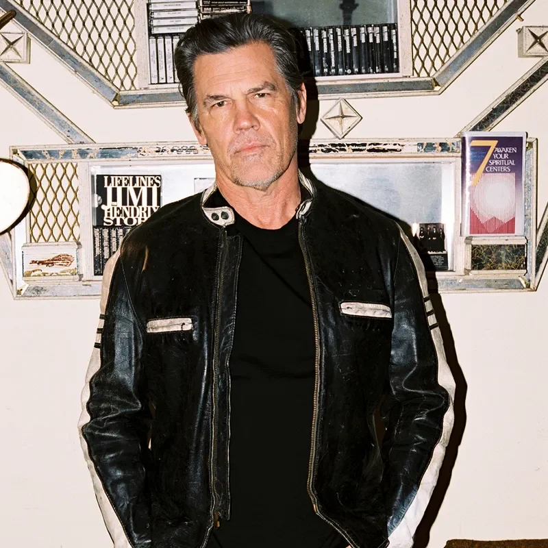 Image may contain: Josh Brolin, Clothing, Coat, Jacket, Adult, Person, Electronics, Speaker, Pants, and Leather Jacket