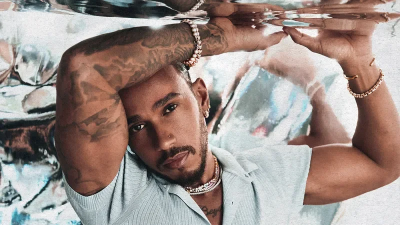 Image may contain: Lewis Hamilton, Accessories, Bracelet, Jewelry, Necklace, Face, Head, Person, Photography, and Portrait