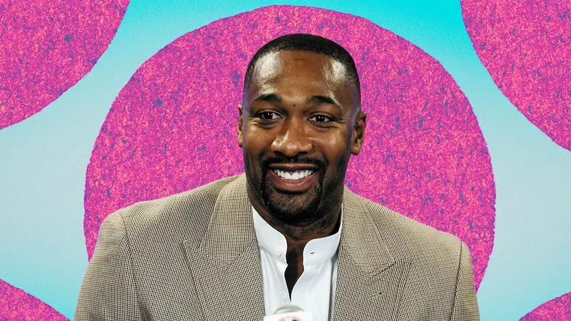 Image may contain: Gilbert Arenas, Adult, Person, Crowd, Electrical Device, Microphone, Blazer, Clothing, Coat, and Jacket