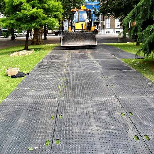 black trak mat install over grass