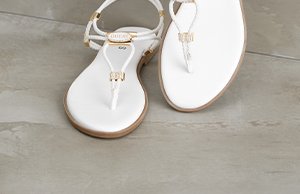 vacation ready sandals featuring a white strappy pair