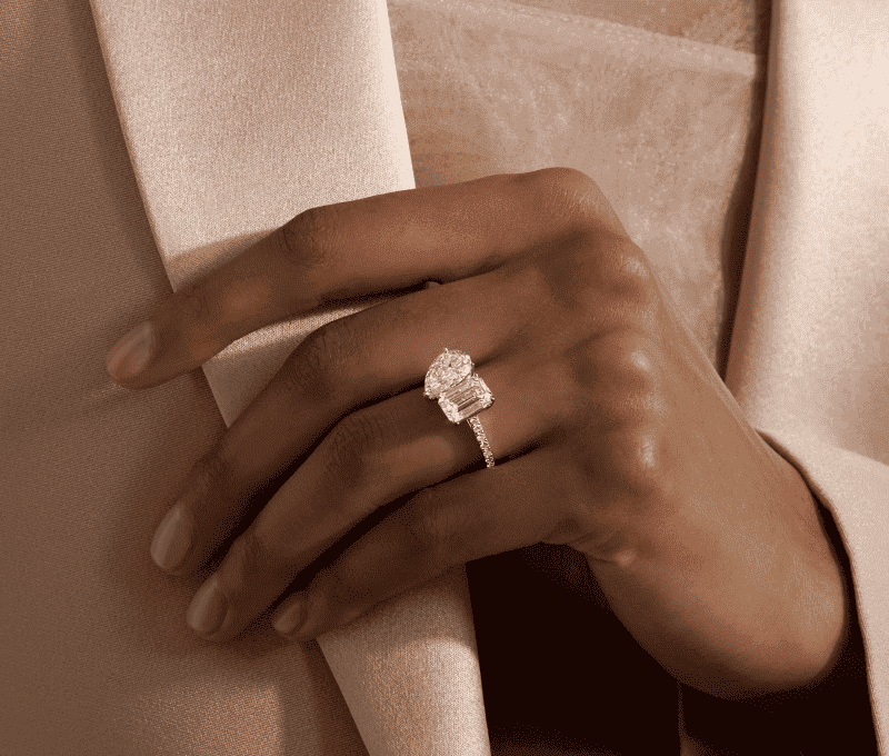A brilliant diamond Wedding ring is prominently displayed.