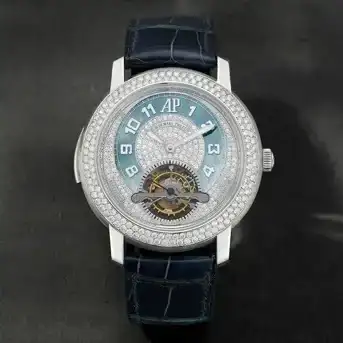 Audemars Piguet. A Very Rare and Impressive 18K White Gold and Diamond Set Minute Repeating Tourbillon Wristwatch