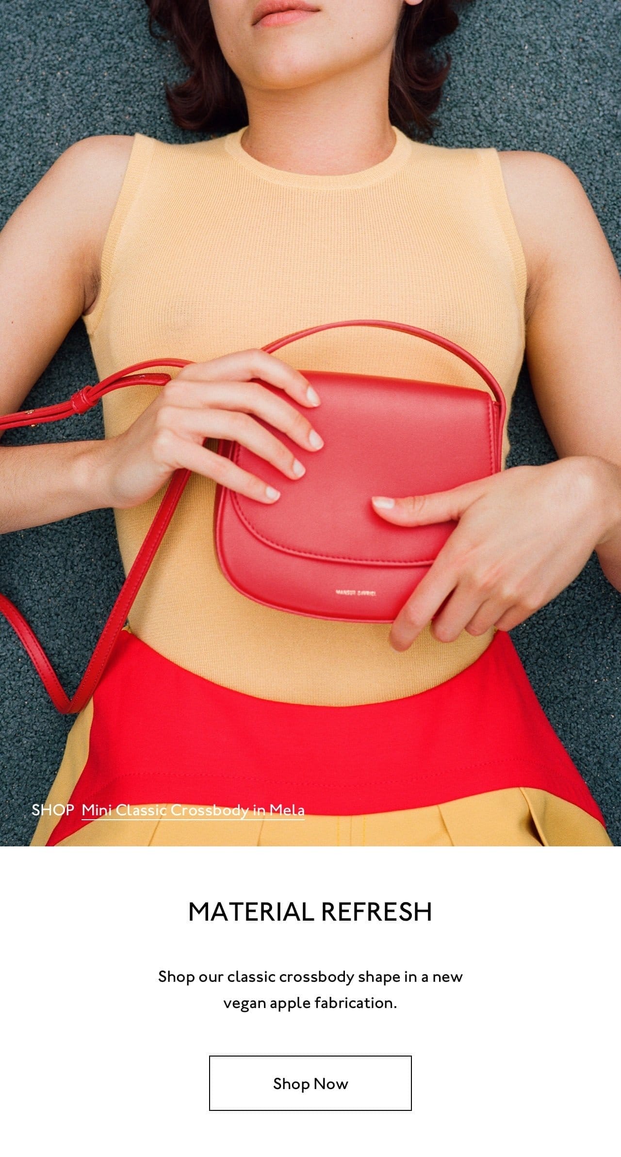 Shop our classic crossbody shape in a new vegan apple fabrication. Pictured: Mini Classic Crossbody in Mela (red).