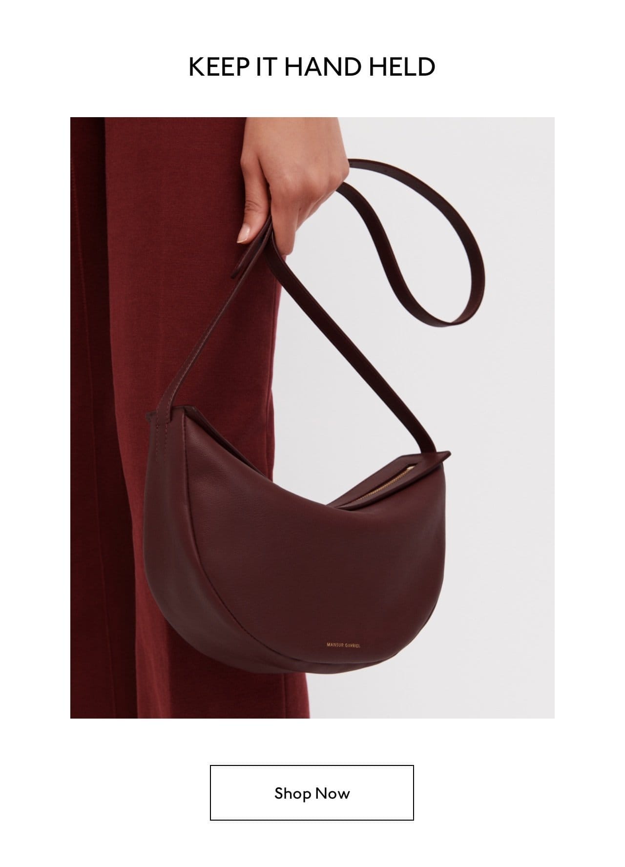 Wear as a crossbody, tucked under your arm, or keep it handheld. Shop the Moon Sling now.