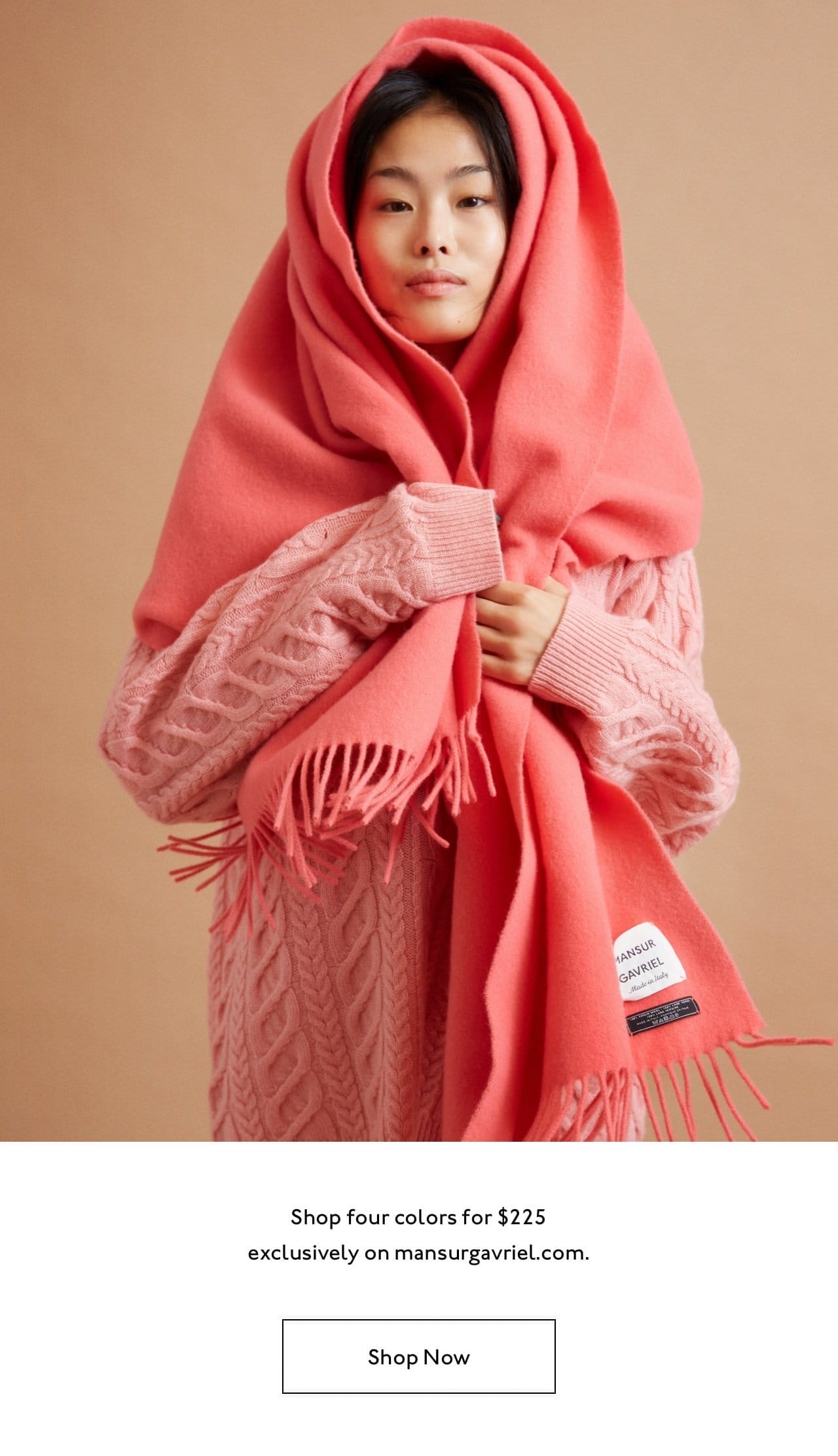 Pictured: our model wearing the Classic Wool Scarf in Flamingo.