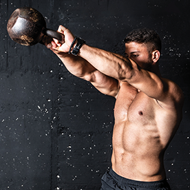 man doing kettlebell exercise