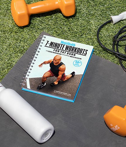 7-Minute workouts for Fat Burn guide sitting on yoga mat with dumbbells next to it