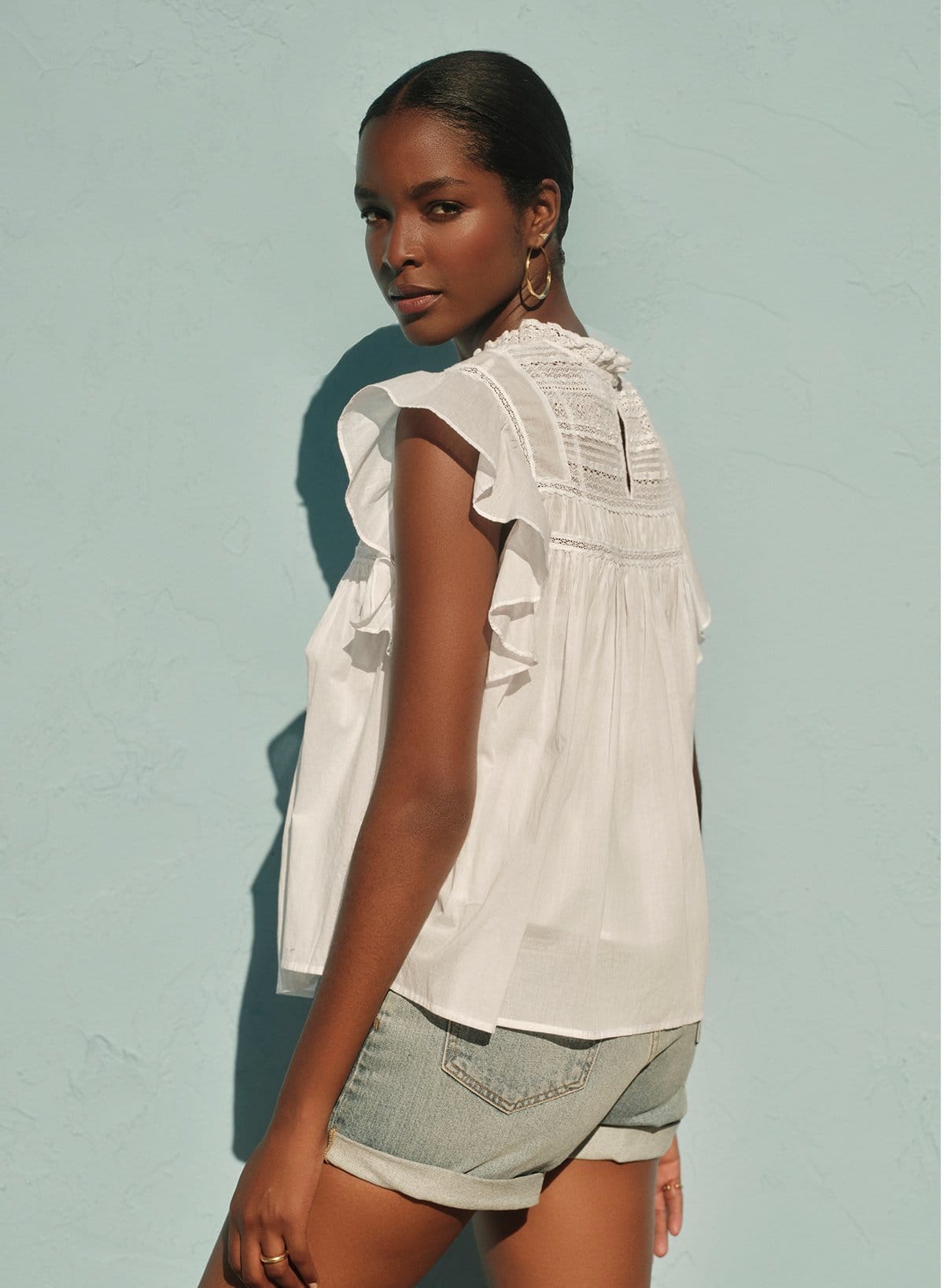 Model wearing the Inessa Cotton Lace Top in White