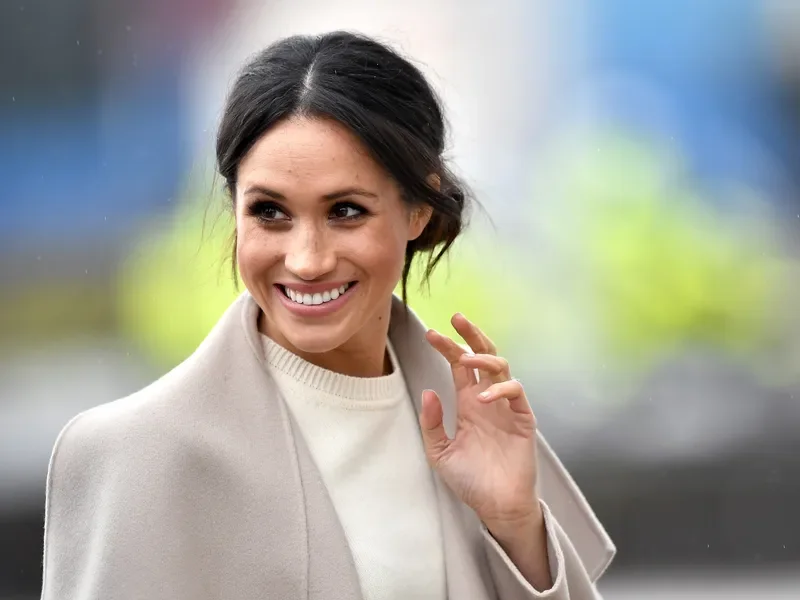 Image may contain: Meghan, Duchess of Sussex, Face, Happy, Head, Person, Smile, Dimples, Adult, Photography, and Portrait